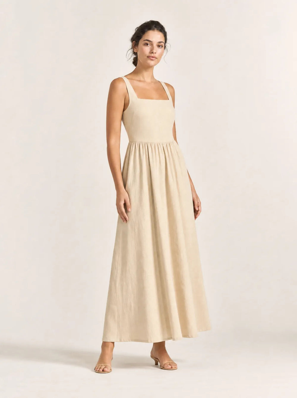 Maren sand gathered maxi dress in a front three-quarter studio view