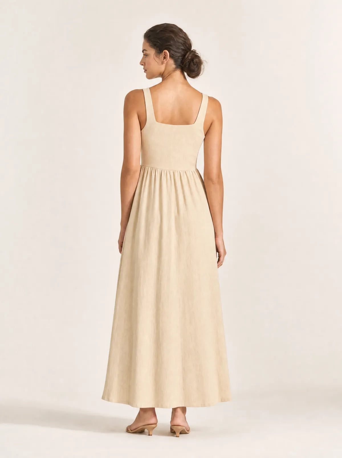 Maren sand gathered maxi dress in a full-length back studio view