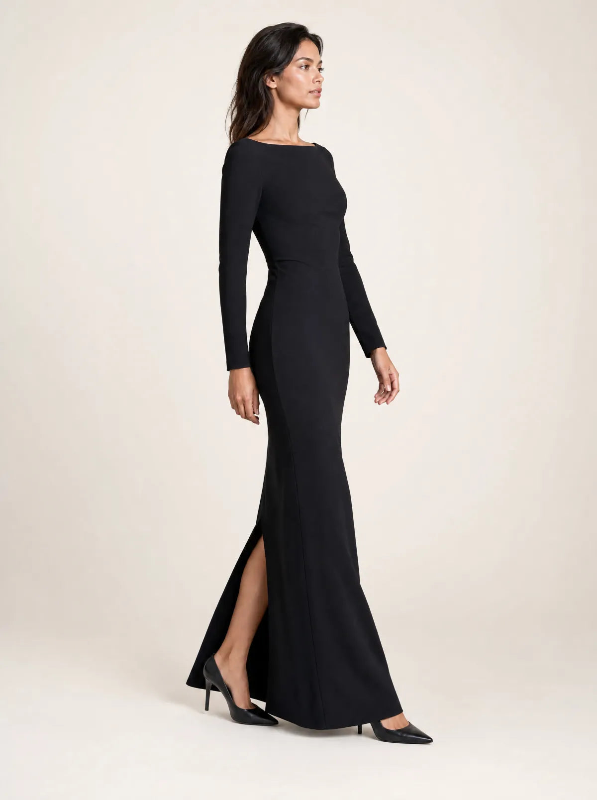 Selene black column maxi dress in a side-profile walking view